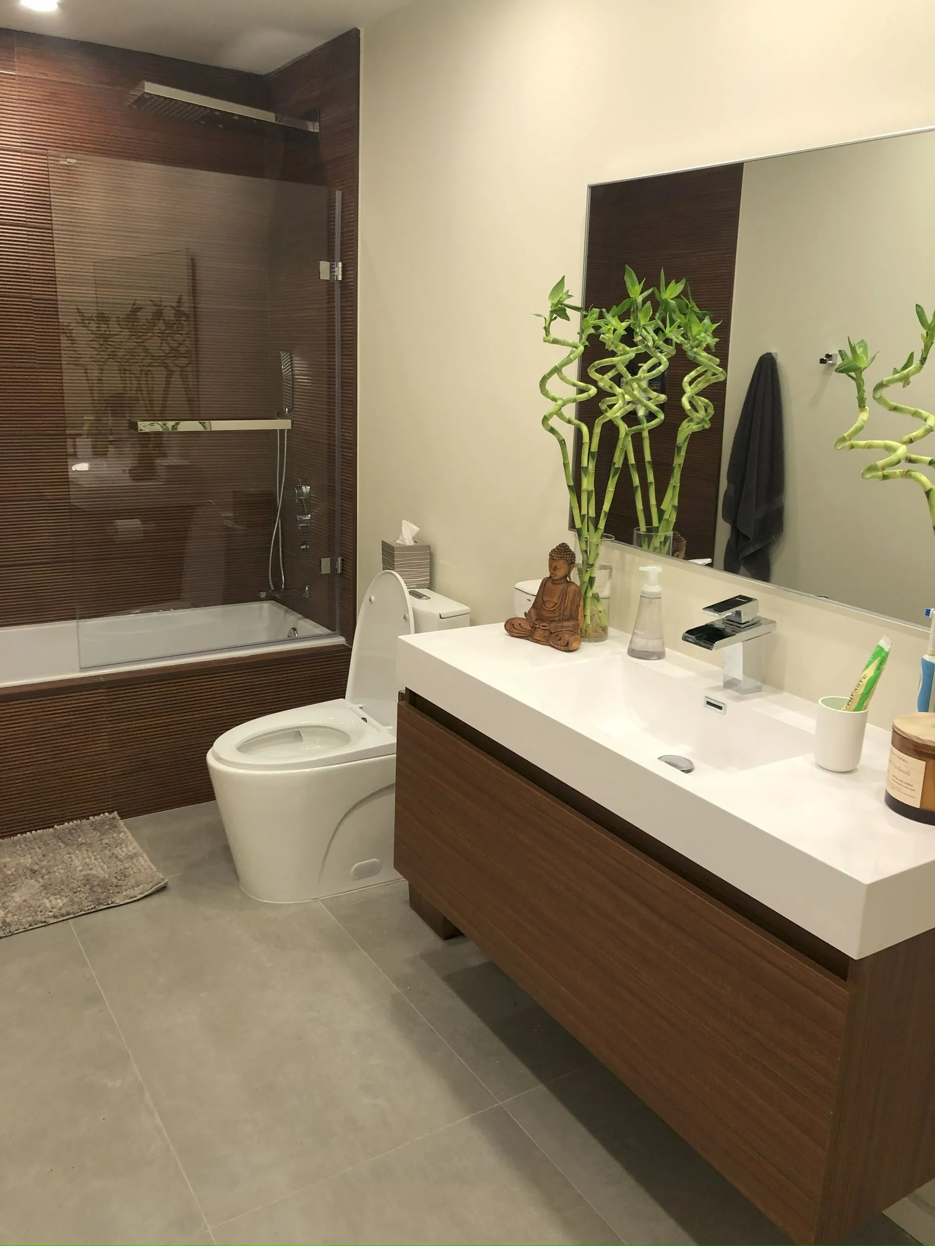 Zen-inspired bathroom with wood tile tub surround and floating vanity - NJ luxury remodel